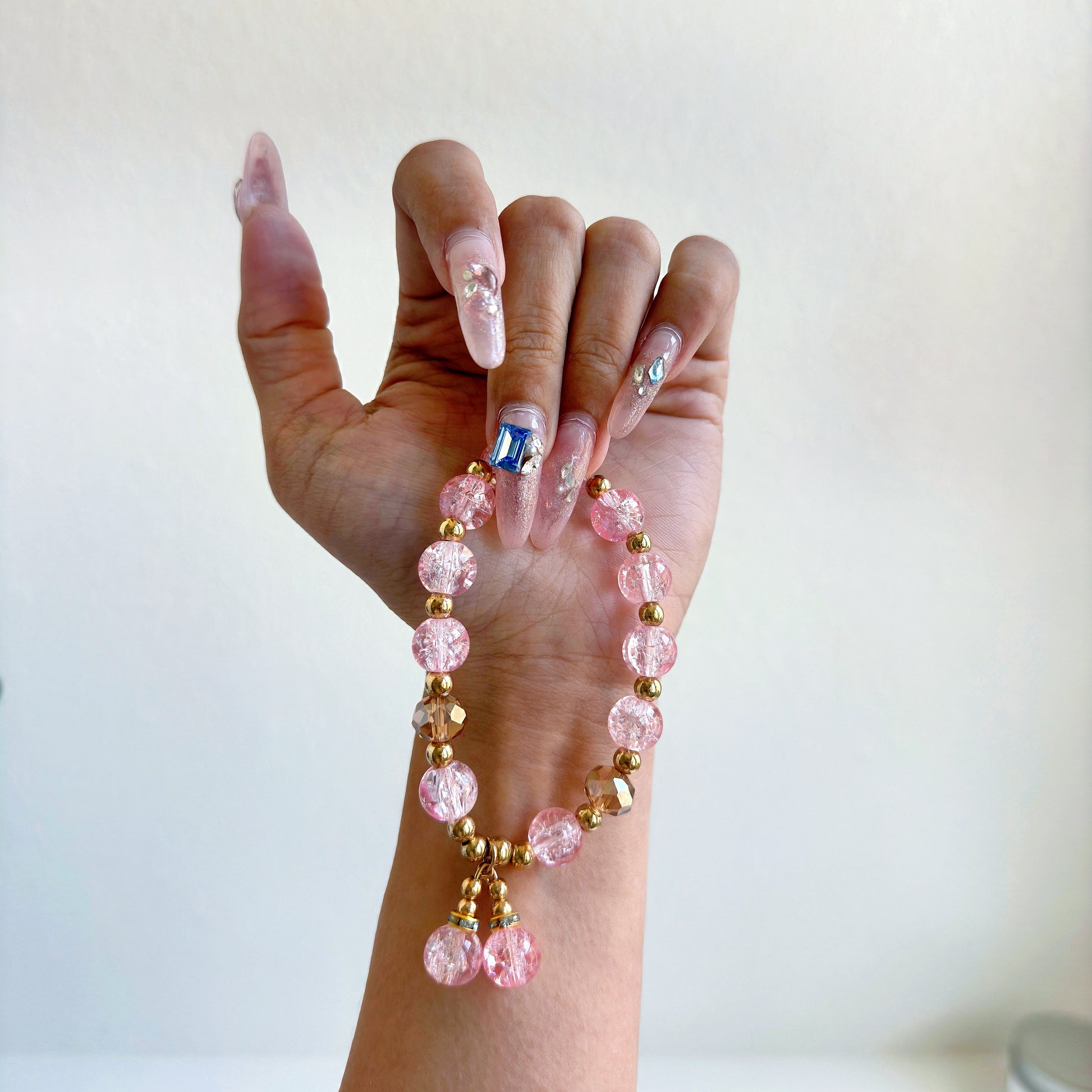 A simple, cute bracelet with light pink glass beads, a perfect gift for her.