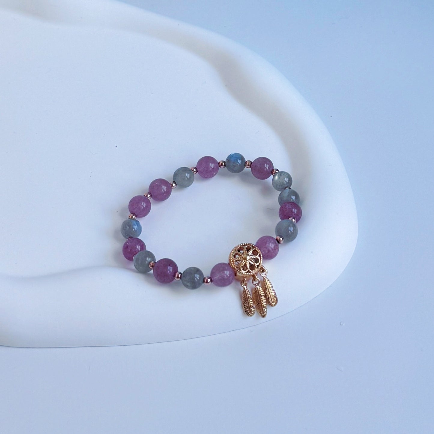 A cute bracelet with strawberry quartz and moonstone beads, golden accents, ideal for a gift for girlfriend, gift for sister, gift for daughter, gift for wife, or gift for friend.