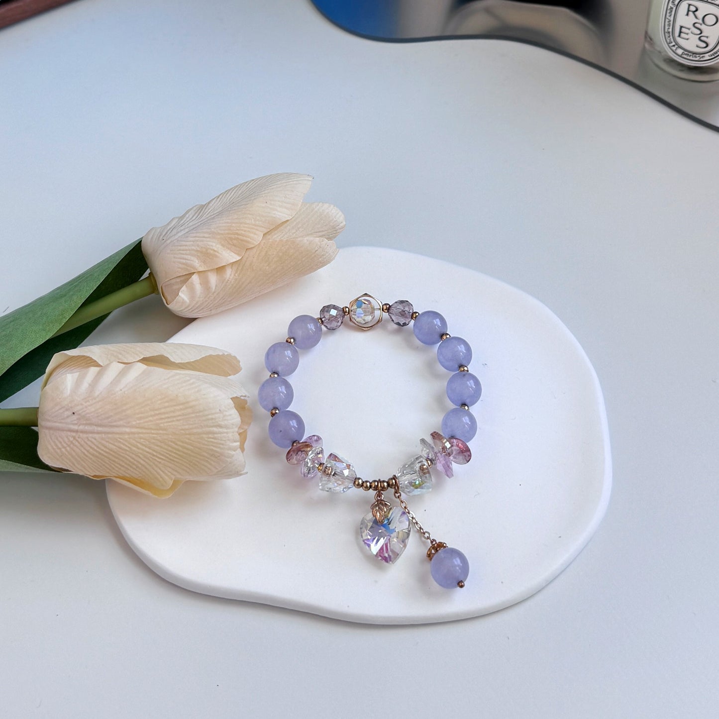 A cute bracelet with light purple amethyst beads and crystal charms, ideal as a gift for girlfriend, gift for sister, gift for daughter, gift for wife, or gift for friend.