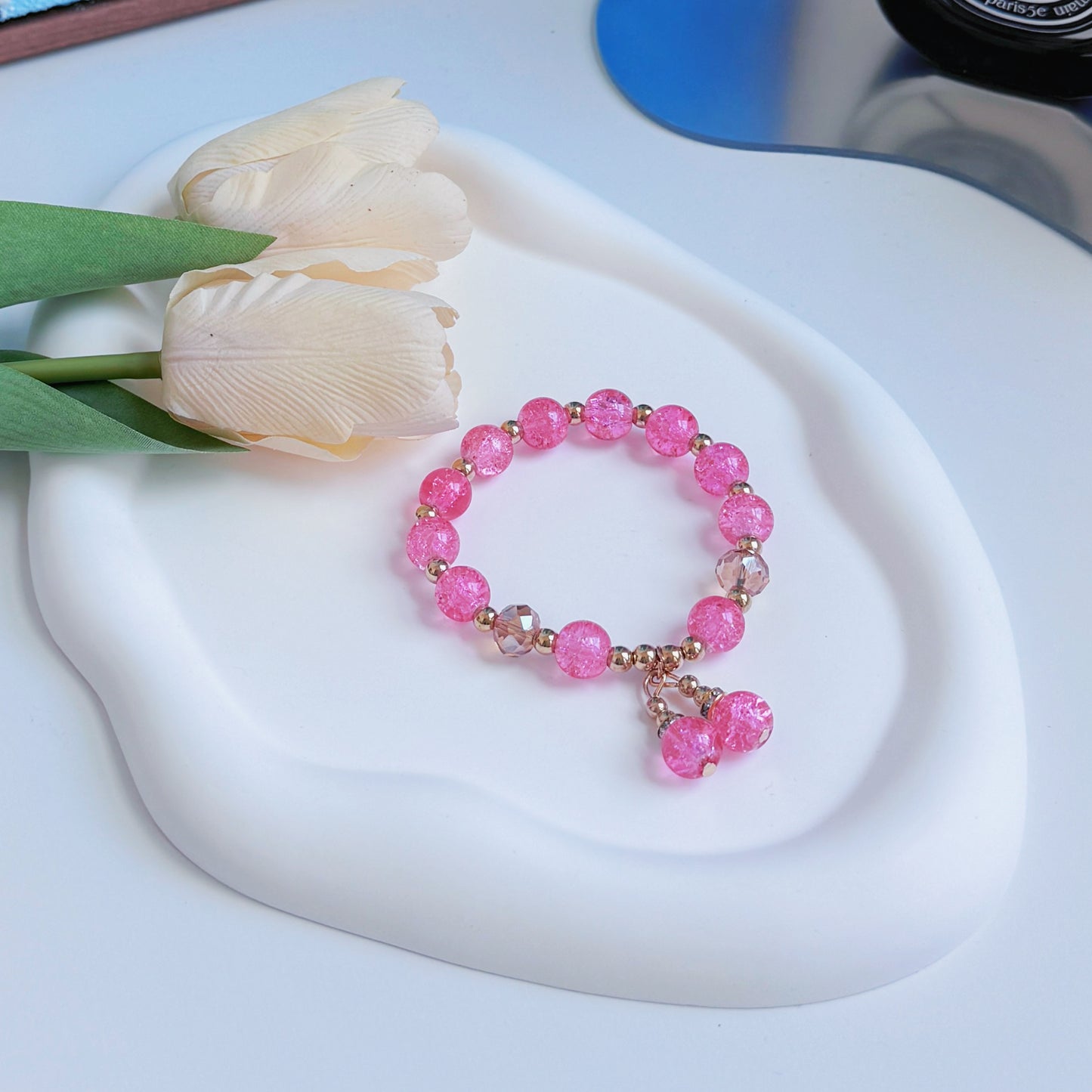 A shimmering pink bracelet, a cute bracelet ready to accent any outfit.