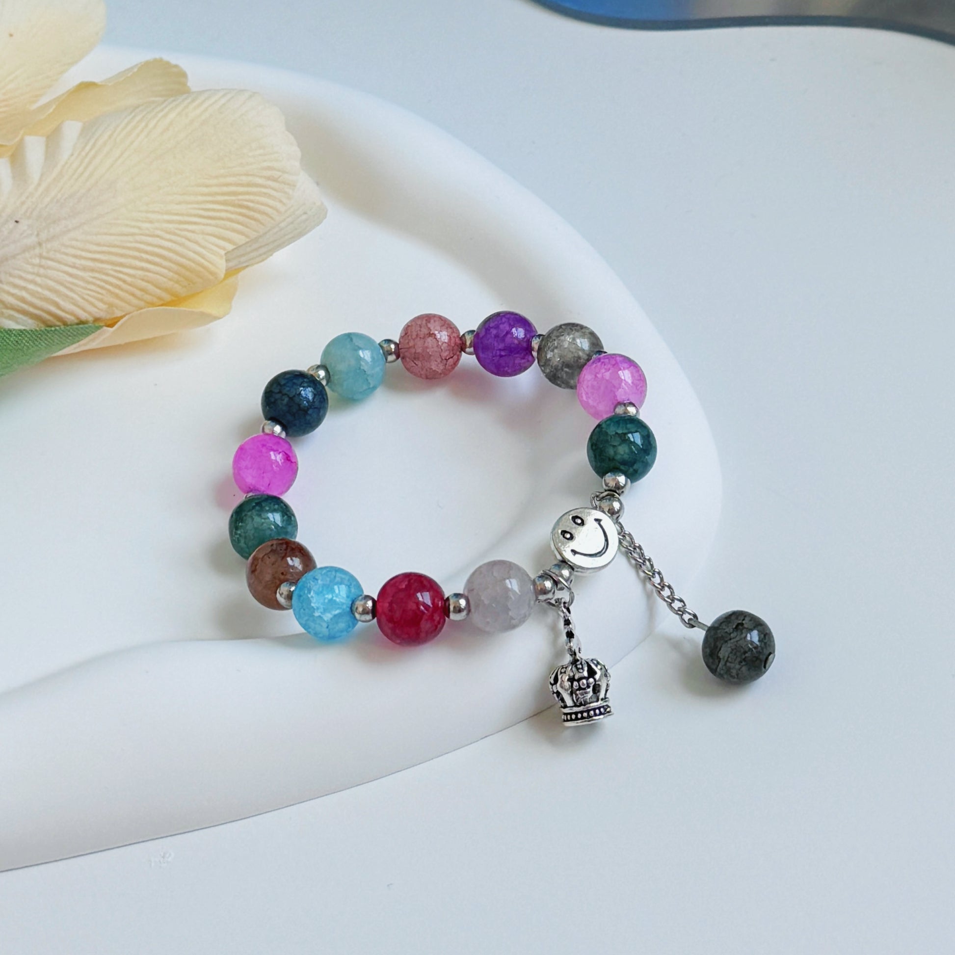 A shimmering glass bead bracelet with multicolored glass beads.