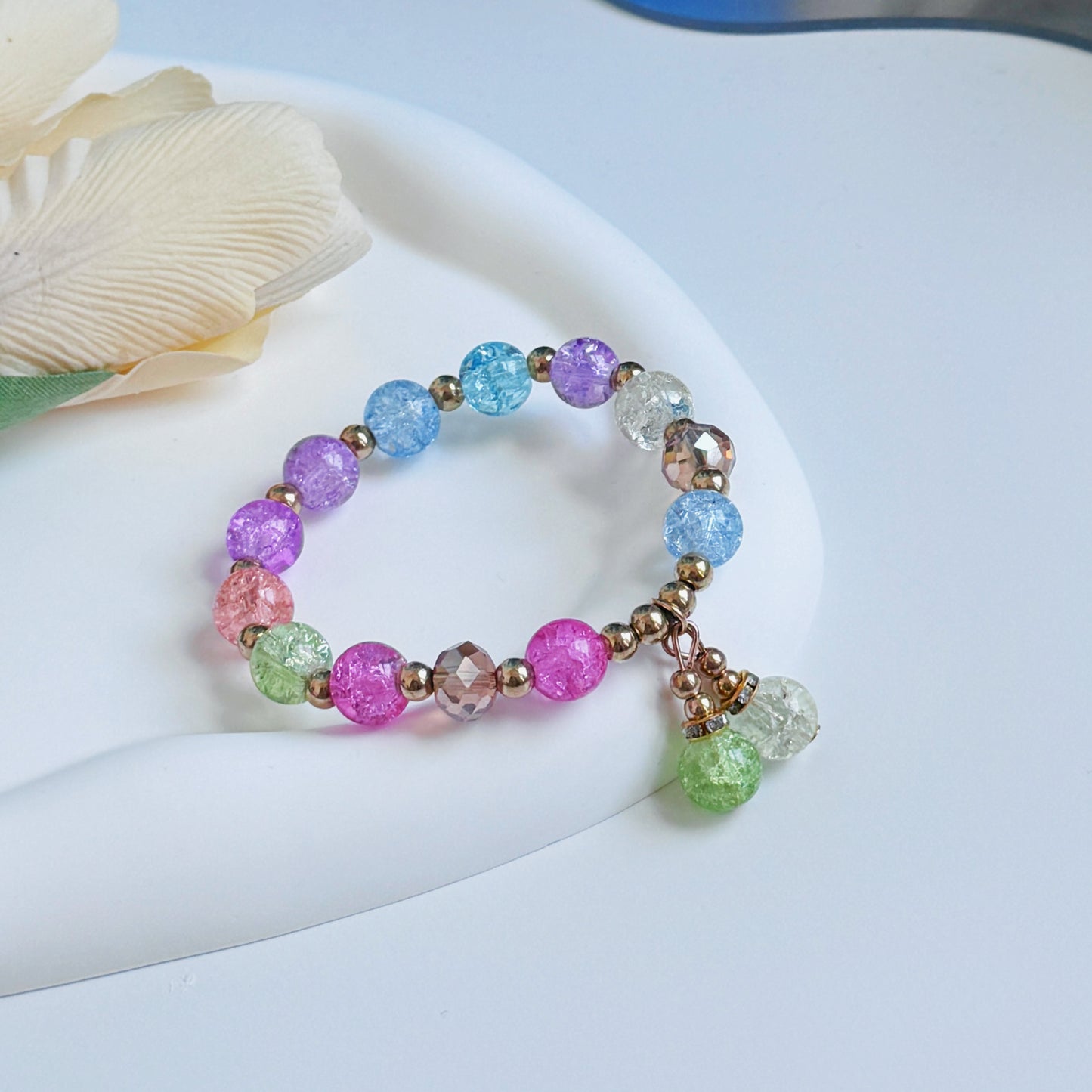 A glimmering multi-color bracelet shining in the sun.