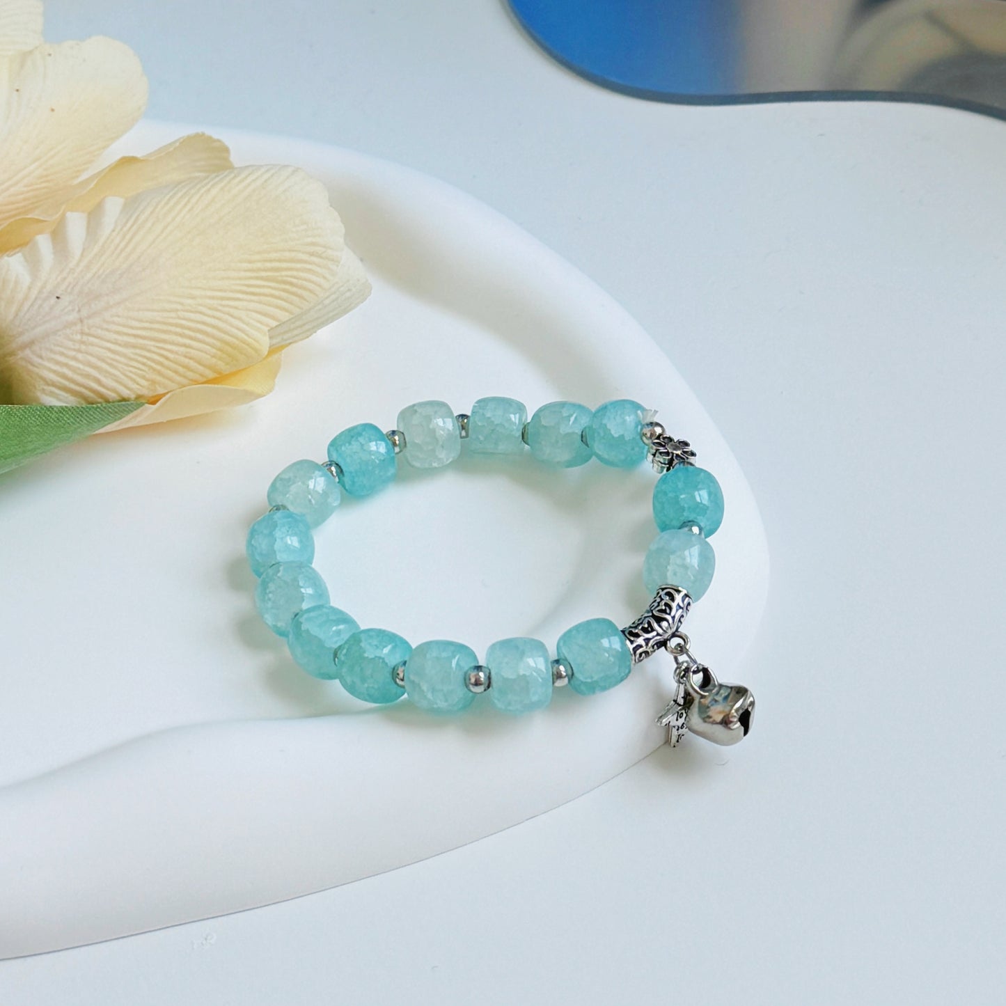 A pretty, simple, and light bracelet, with blue-green color.