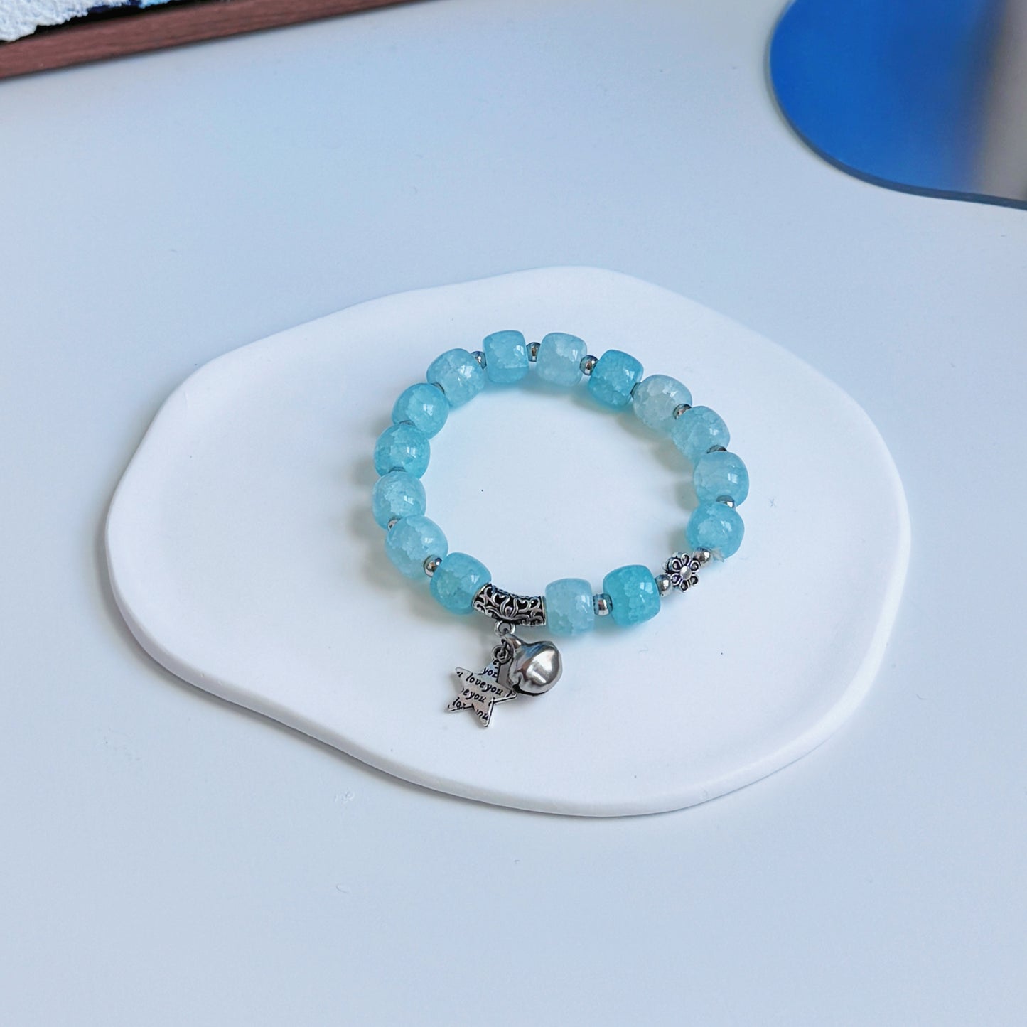 A simple, cute bracelet with light teal glass beads, a perfect gift for her.