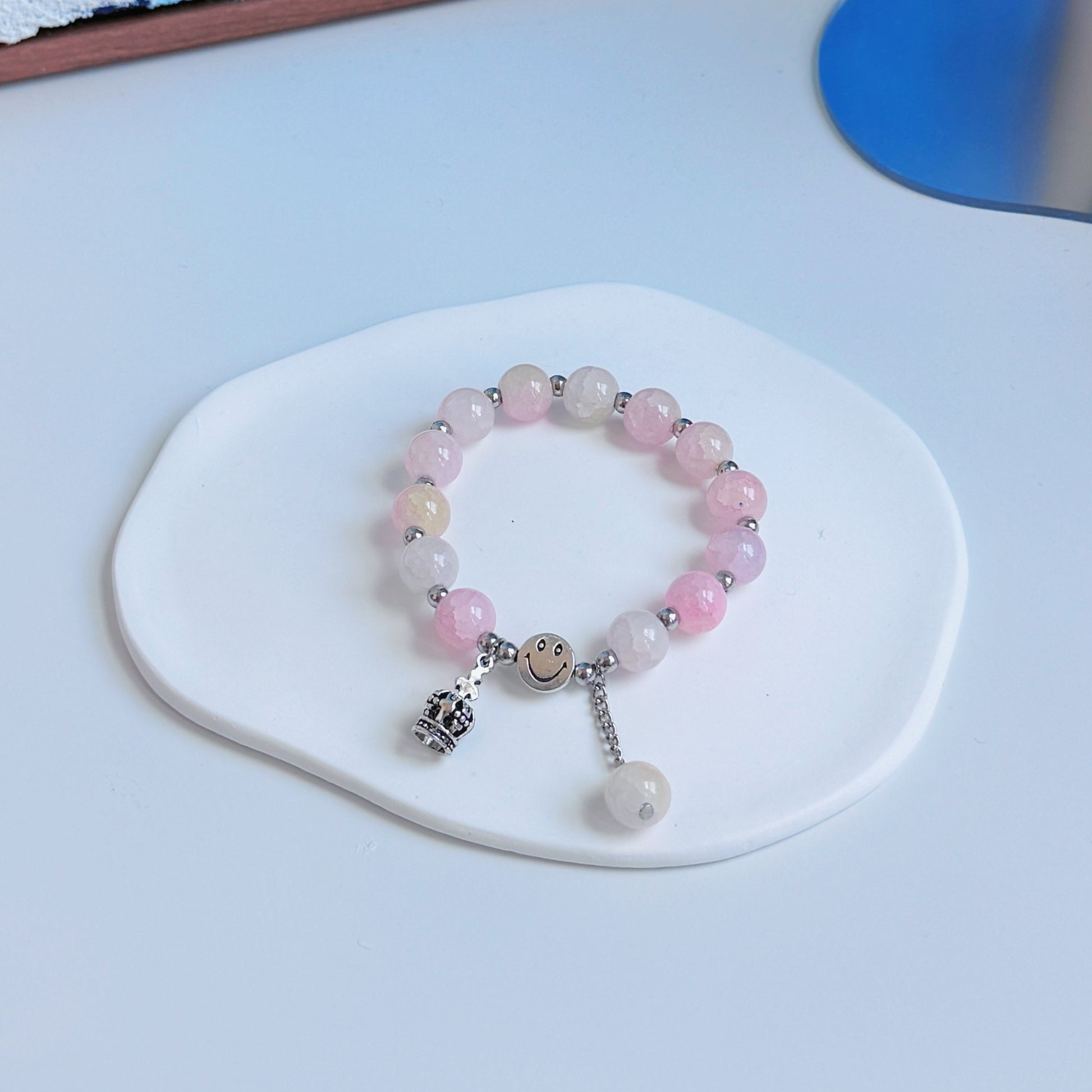 A simple, cute bracelet with light pink glass beads, a great fashion piece to add to any outfit.