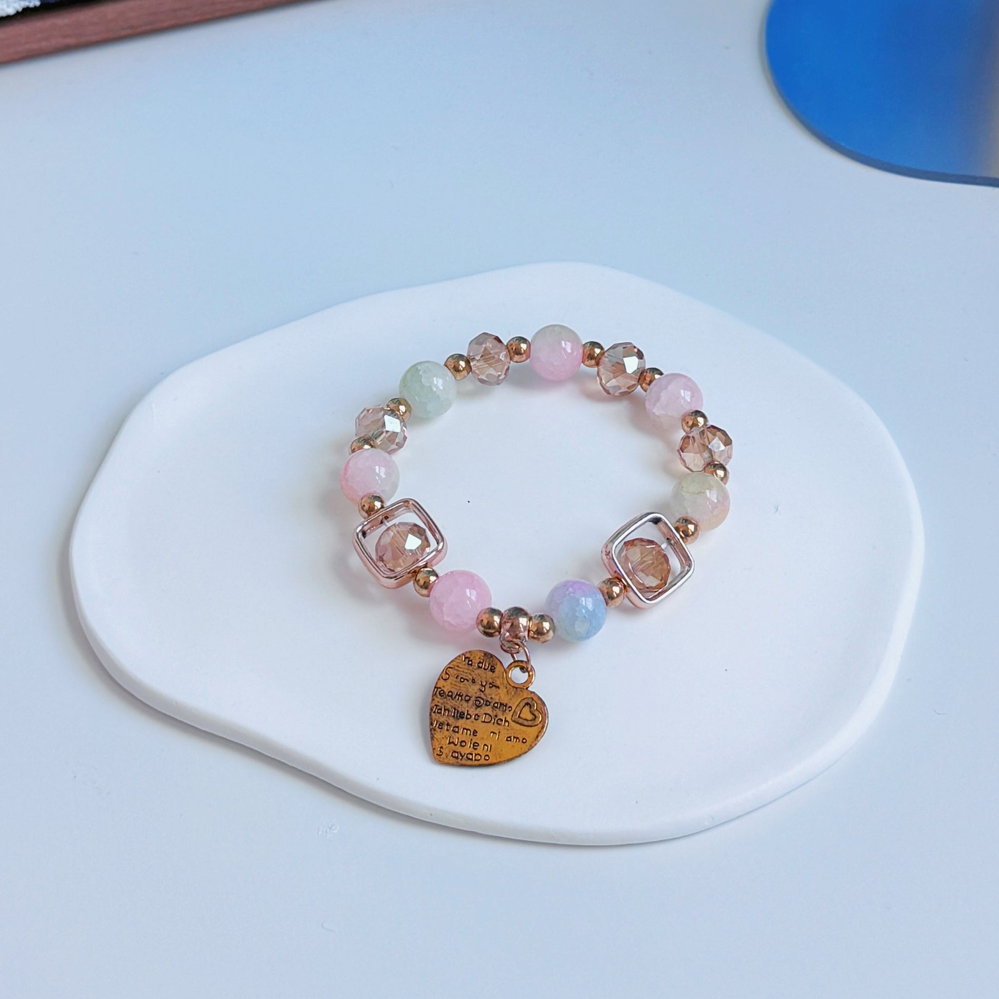 A simple, cute bracelet with pink and gold beads and brass accents, a perfect gift for her.