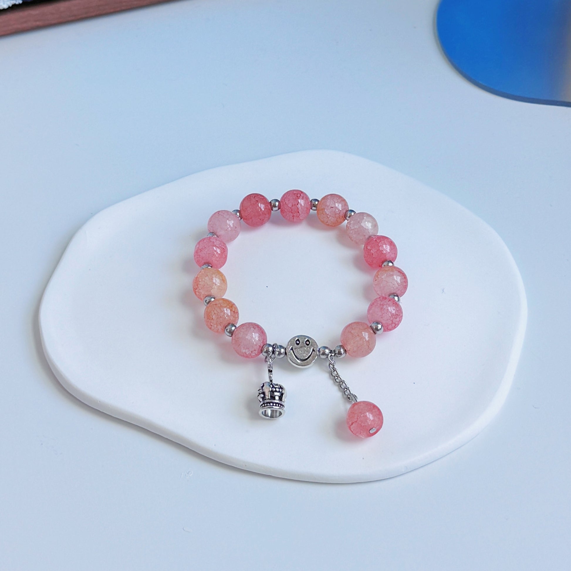 A simple, cute bracelet with amber and pink glass beads, a pretty, simple accessory and a fashionable addition to any outfit.