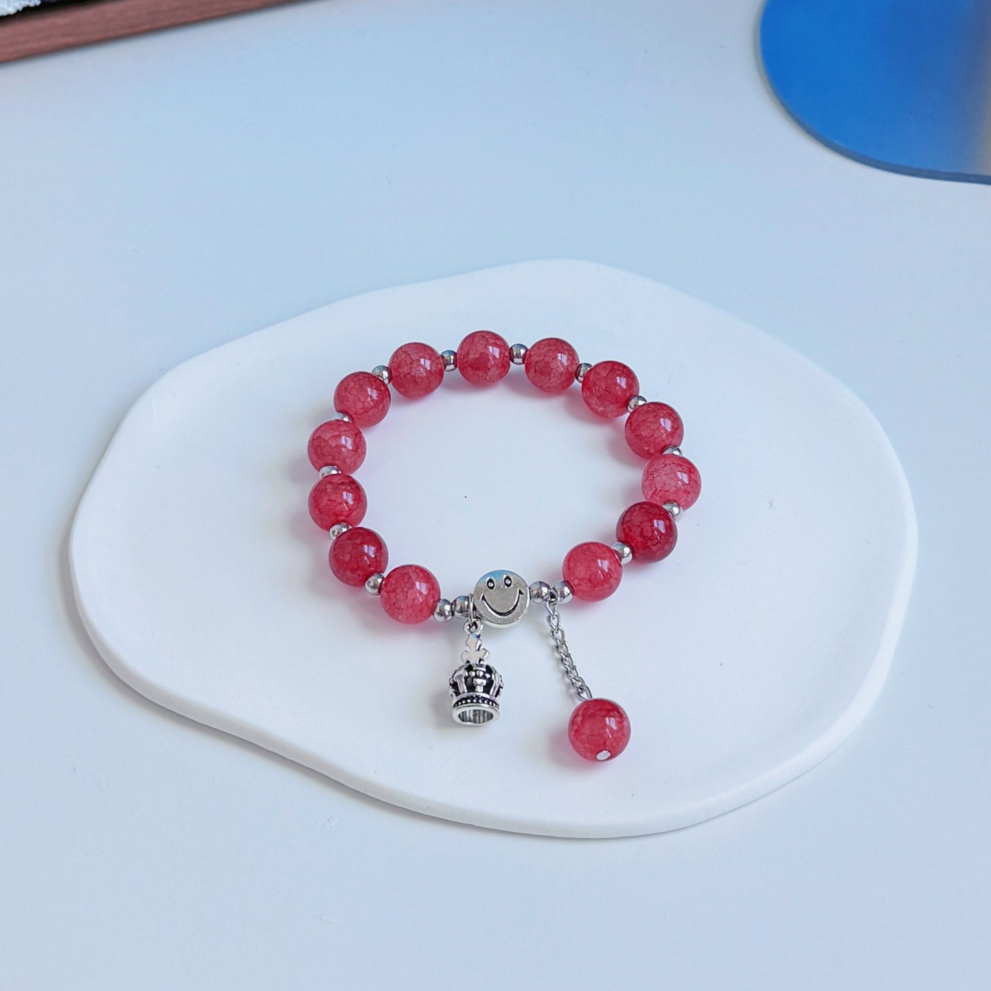 A simple, cute bracelet with crimson red glass beads, a perfect fashionable addition to any stylish outfit.