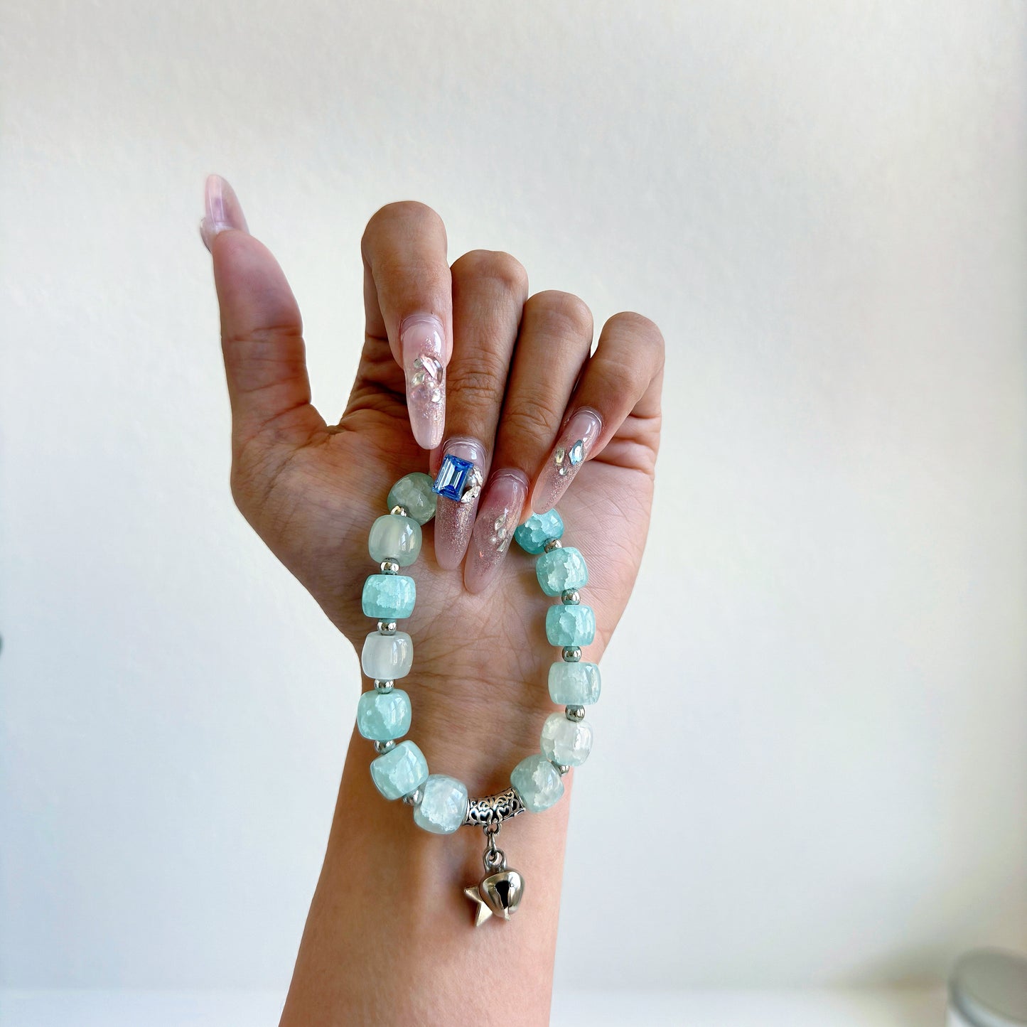 A simple, cute bracelet with light aqua beads, a perfect fashion accessory to add to any outfit.