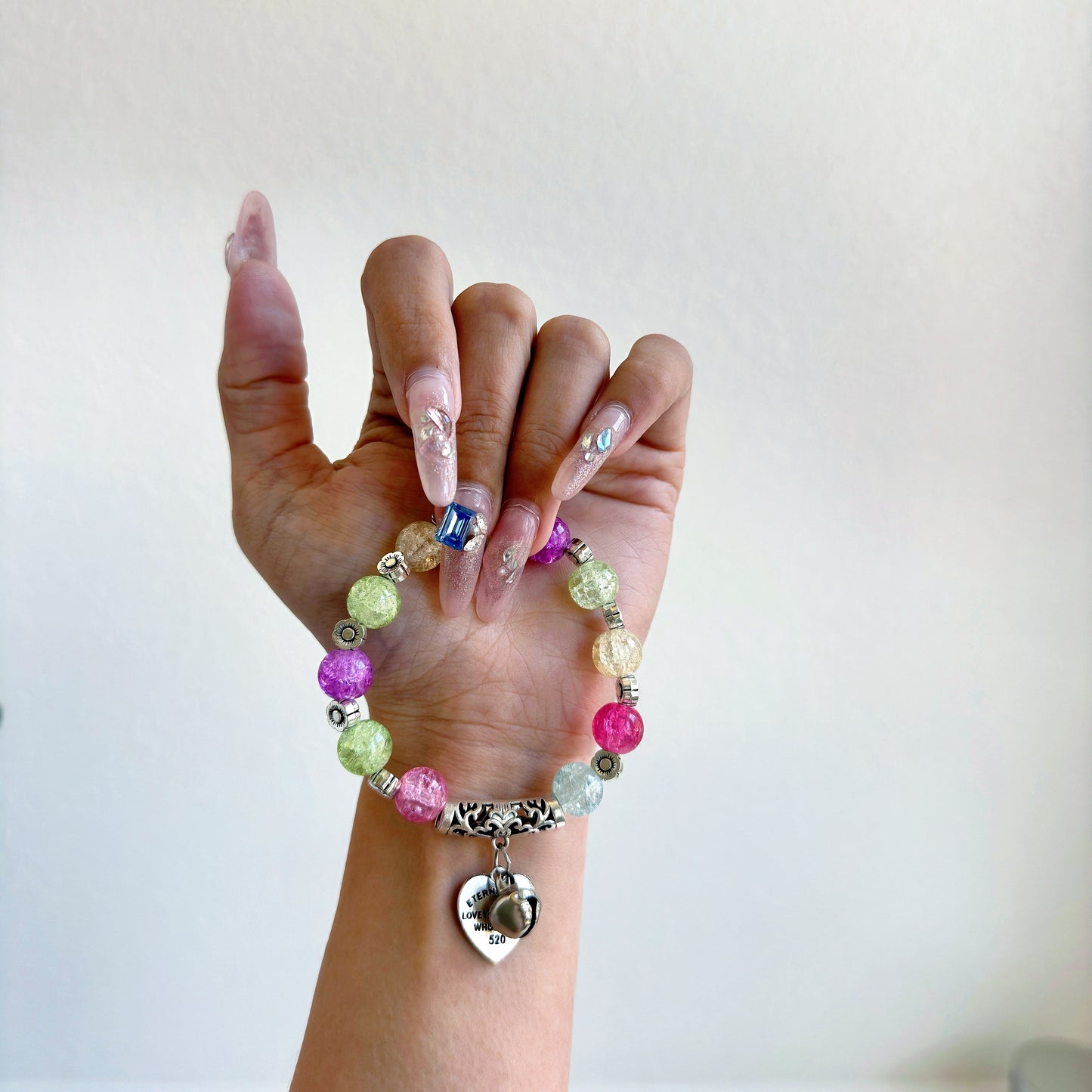 A simple, cute bracelet with multicolored glass beads, a perfect gift for her.