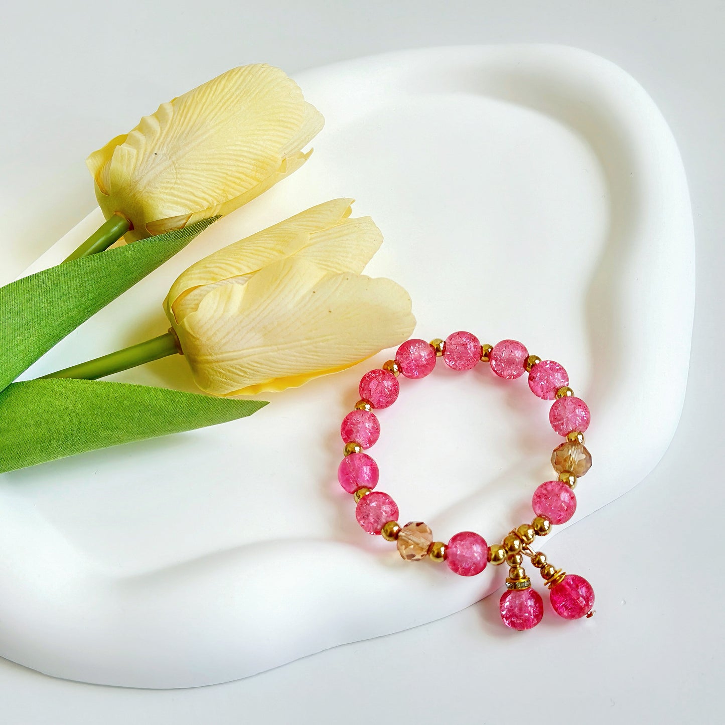 A hot pink bracelet ready to be worn or given as a gift for a daughter, a gift for a wife, a gift for a girlfriend, or a gift for a sister.