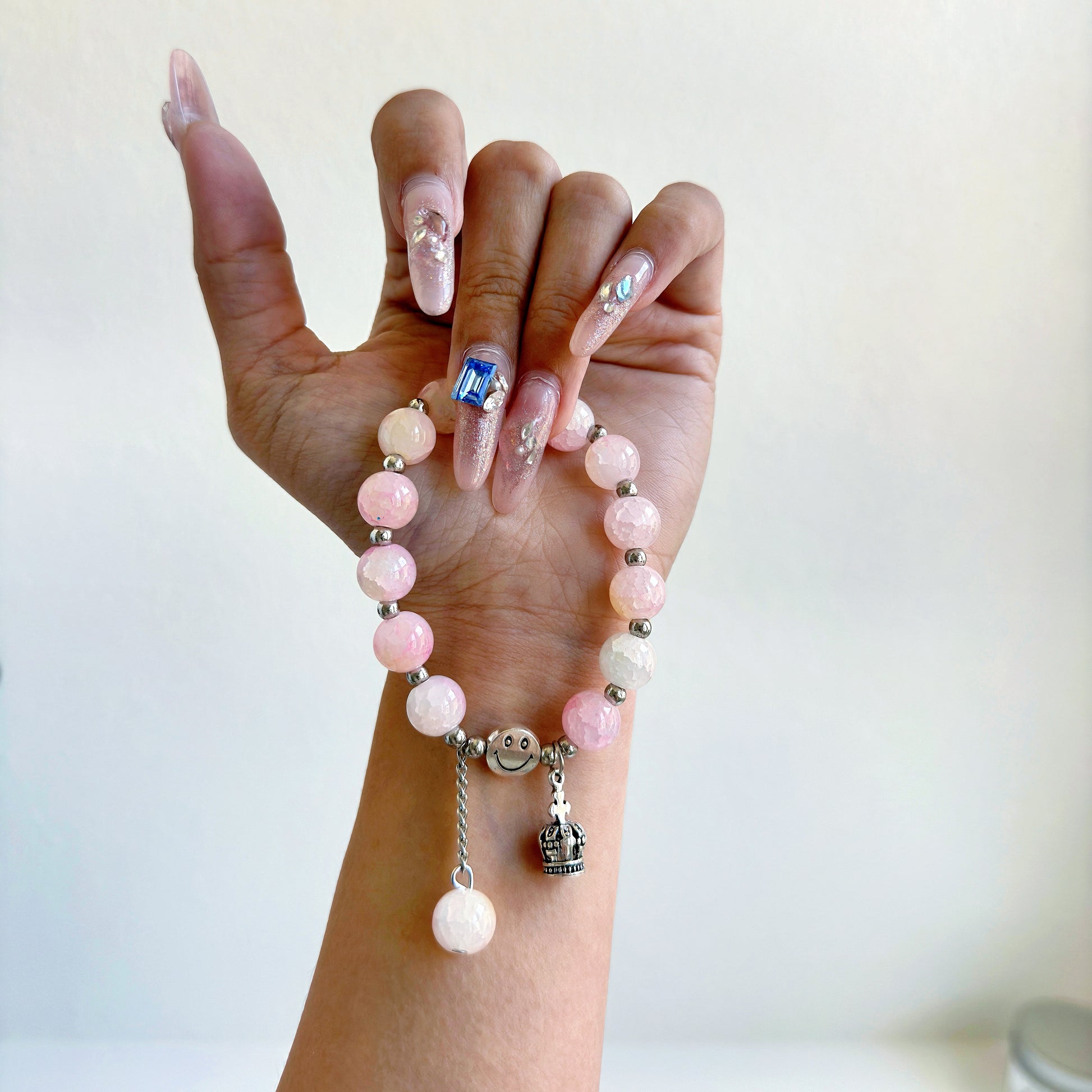 A simple, cute bracelet with light pink glass beads, a perfect gift for her.