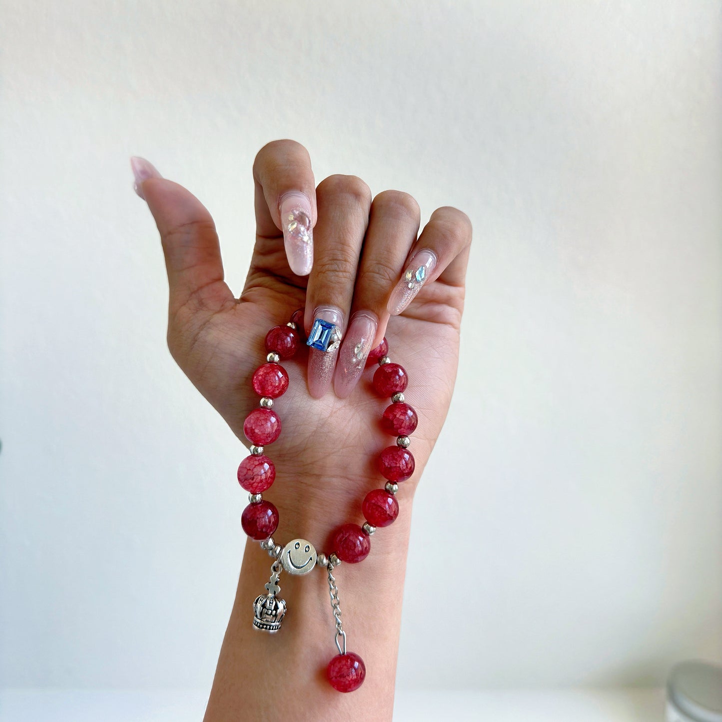 A simple, cute bracelet with crimson red glass beads, a perfect gift for her.