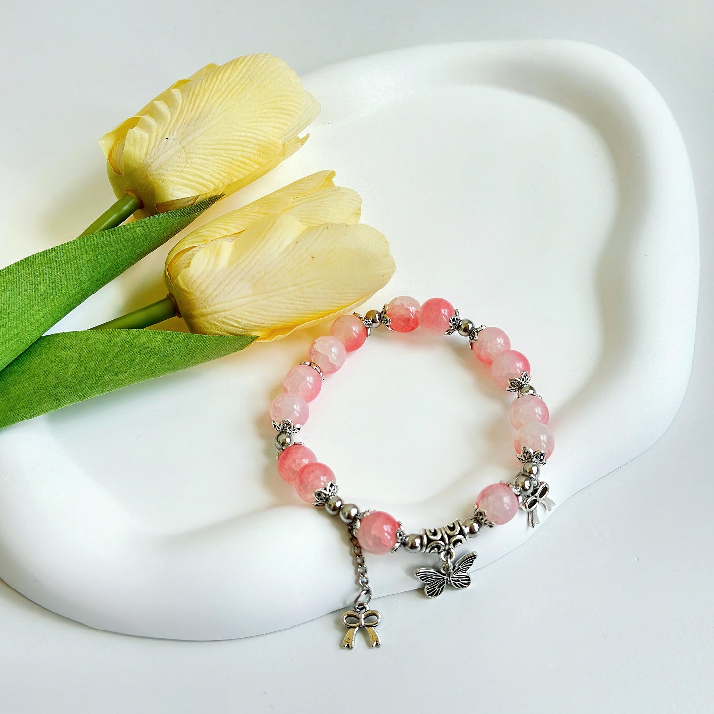 A stunning pink glass bead bracelet ready to add a fashionable element to any stylish outfit.