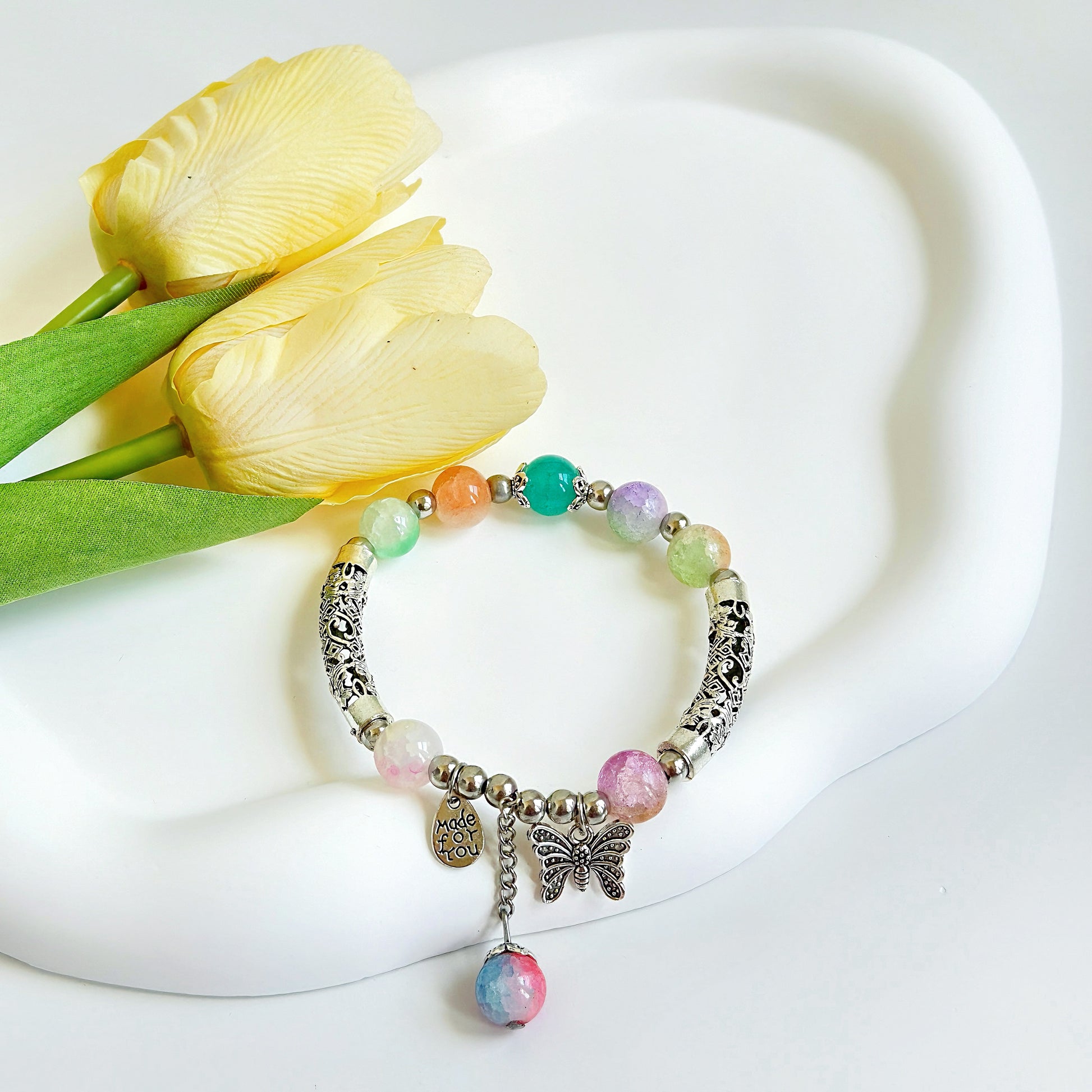 A beautiful multi-colored bracelet, ready to add a fashionable element to any outfit.