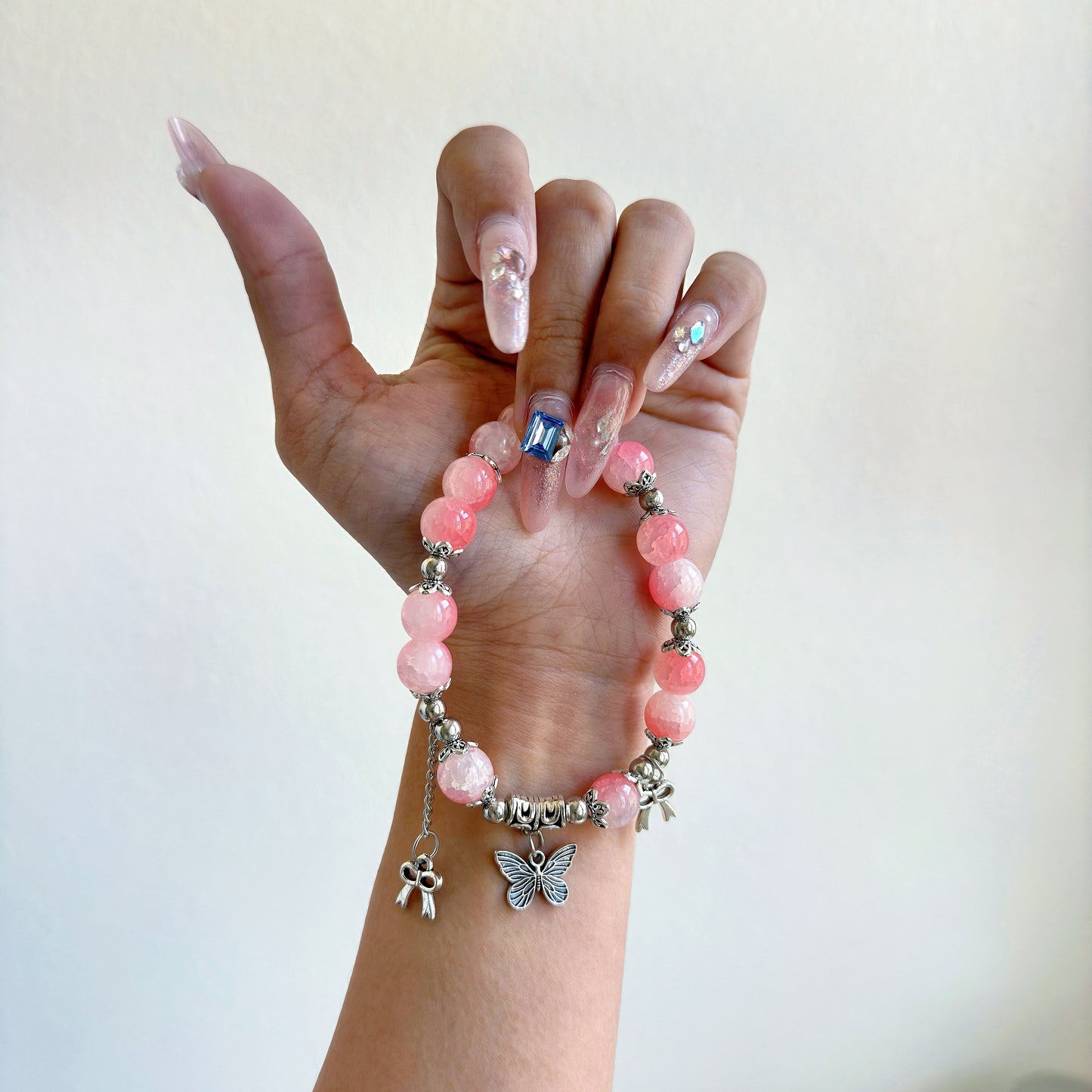 A simple, cute bracelet with light pink glass beads, a perfect gift for her.